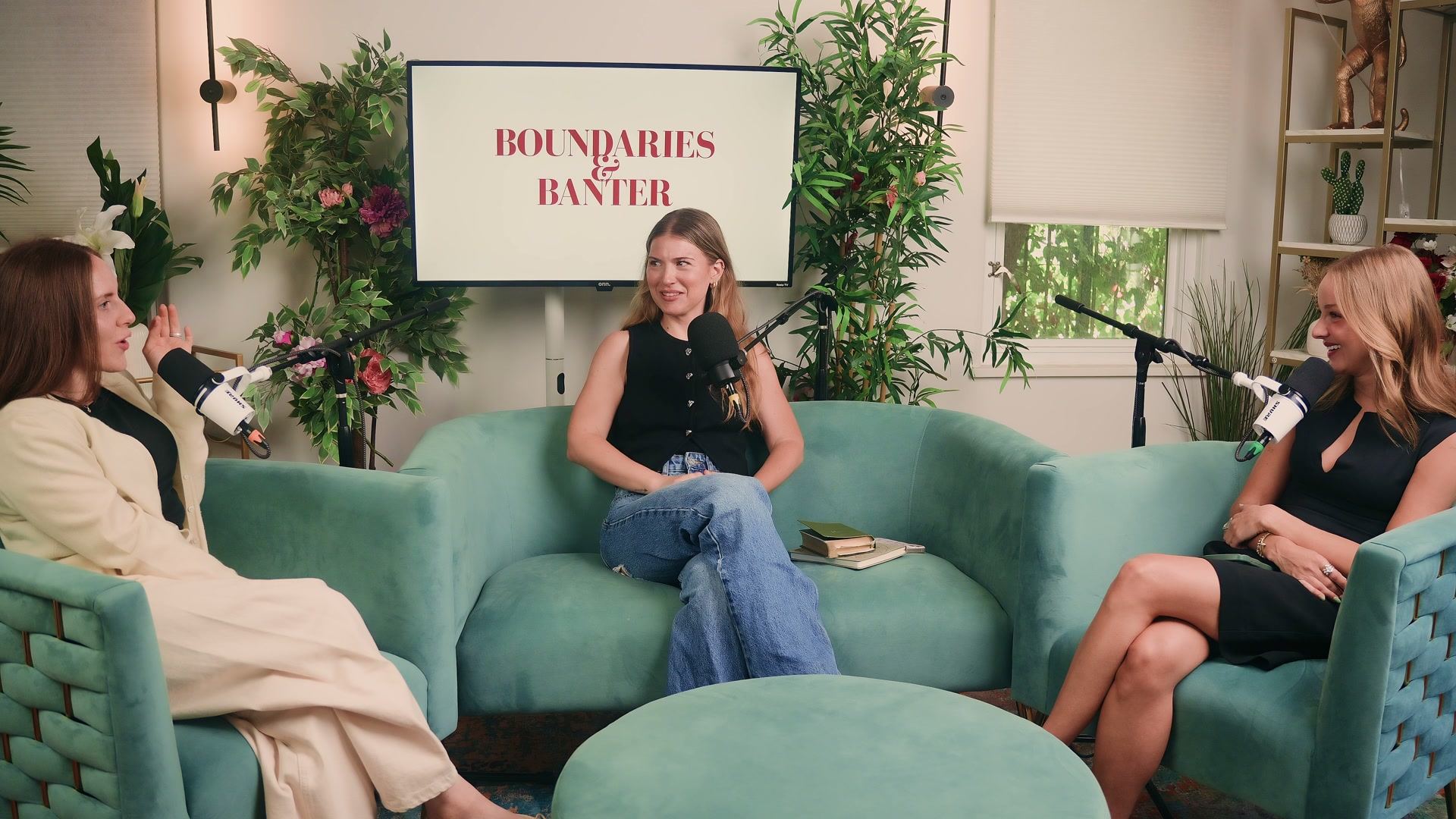 Michela, guest Amanda Pastrnak, and Taryn recording Boundaries & Banter on a set of green velvet chairs.