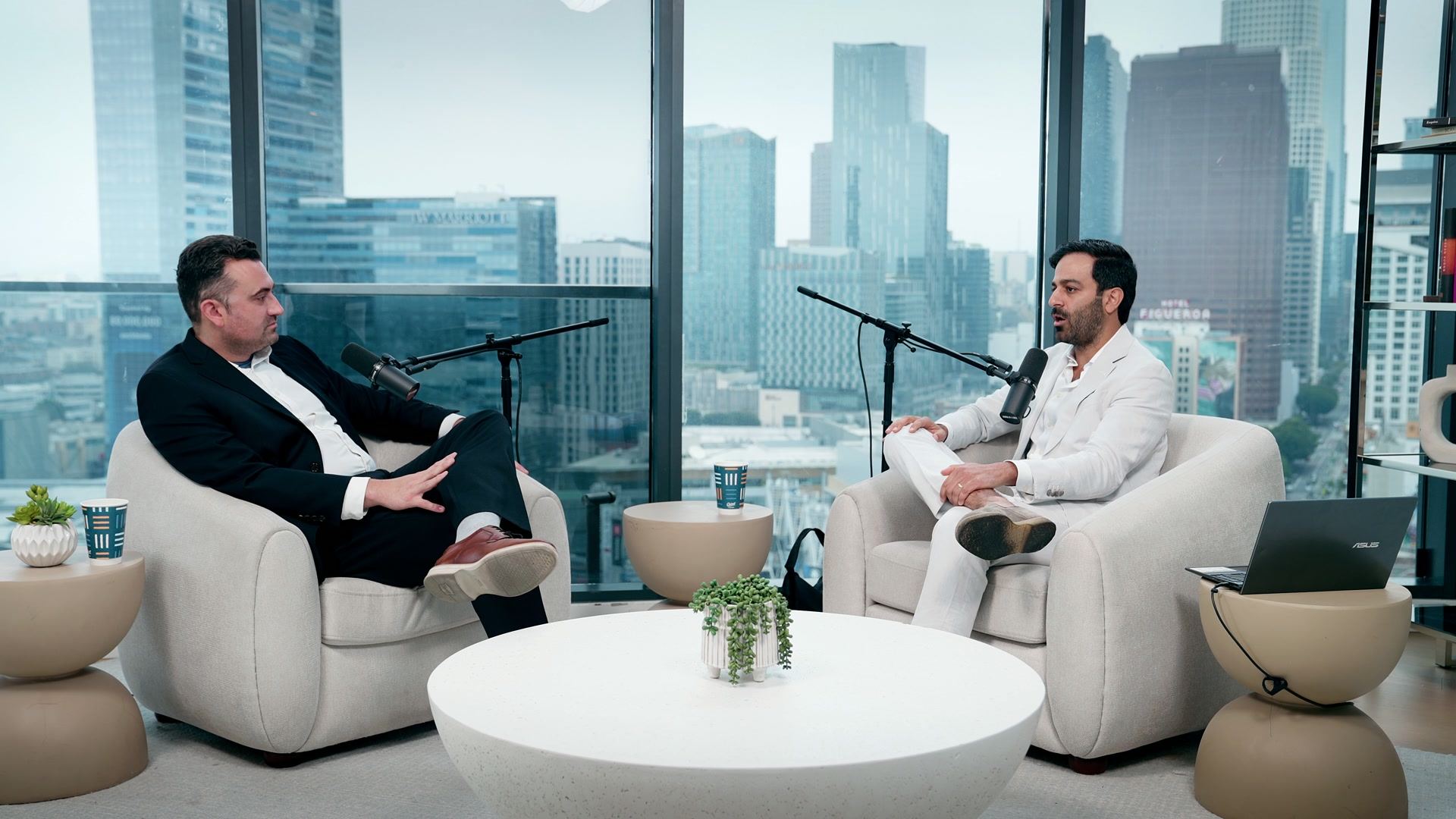 Dr. Pat Baumgart and Dr. Mike Mah recording Episode 9 of Real Mental Health in a high-rise studio overlooking downtown Los Angeles.